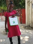 Jesse showing off her new laptop, donated by author David Weinberger
